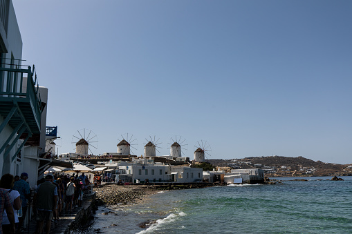 Harbour view of the famous windmills in oldtown Mykonos, Greece