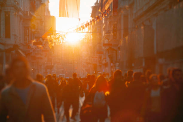 istock Crowd on street in bright lens flare 2020130284