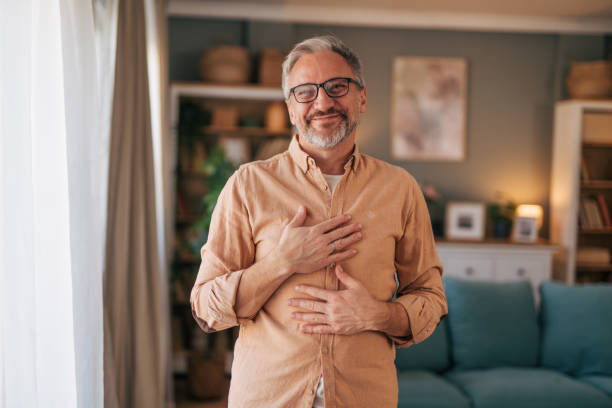 istock Mature man gesturing like he is being complimented 2020142357