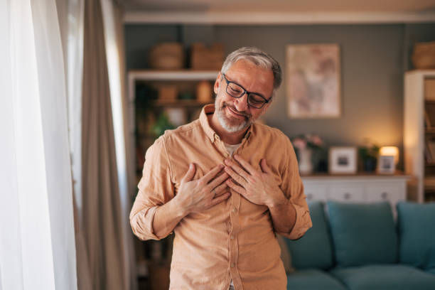 istock Man with arms on his chest looking grateful 2020142486