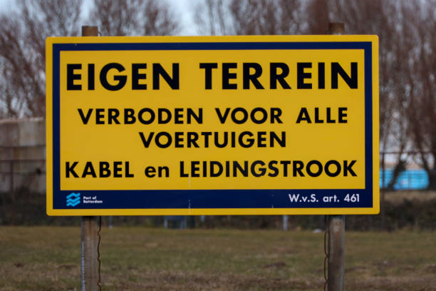 Sign in Dutch with warning Own Terrain Cable and pipe stripSign in Dutch with warning Own Terrain Cable and pipe strip