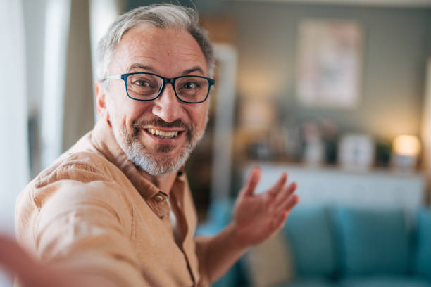 istock Headshot of man smiling at camera and gesturing 2020147846