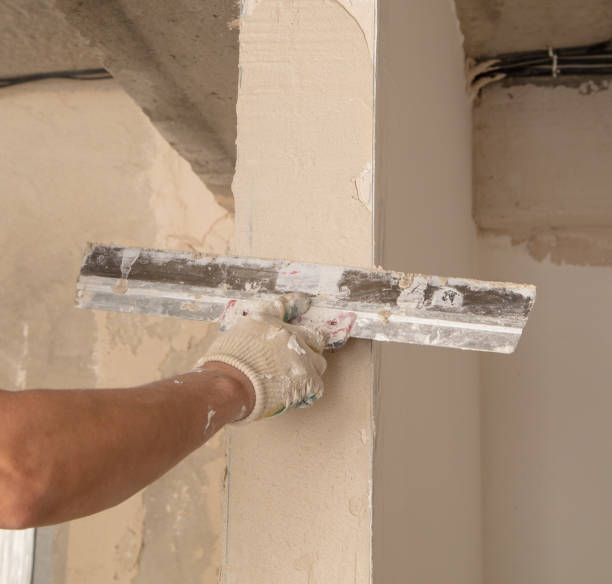 istock A worker is plastering the walls of a house under construction 2020179905