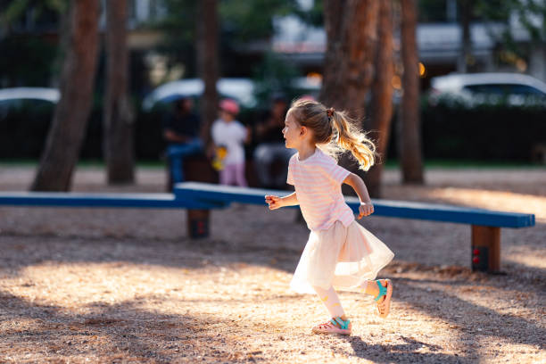 istock Smiling Girl Running In The Park 2020183243