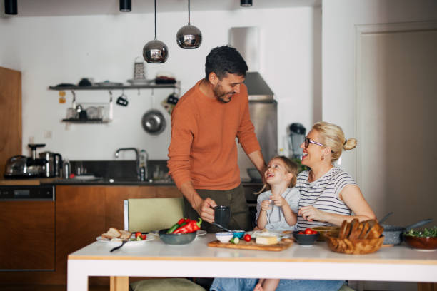 Happy Family Having A Breakfast At Home