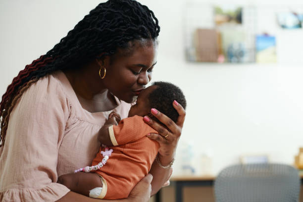 istock Mother Kissing Newborn Baby 2020191367