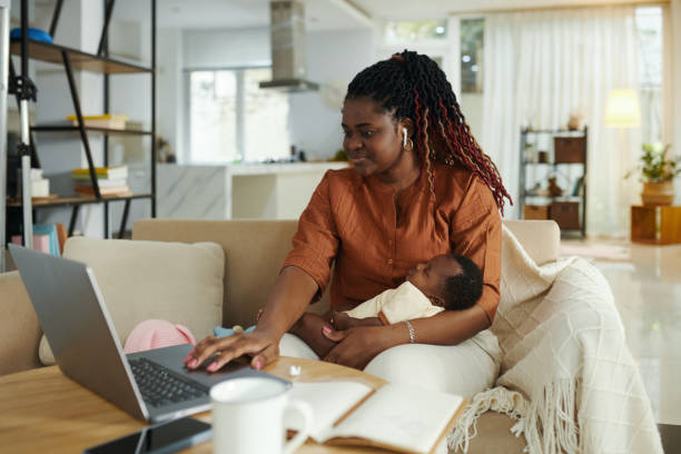 istock Mother of Newborn Baby Working 2020191403