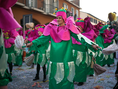 Busto Arsizio, Italy - February 2024, 17: people in masks celebrate the carnival on the streets of the city