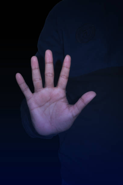 Man making stop sign with his hand at grunge background.