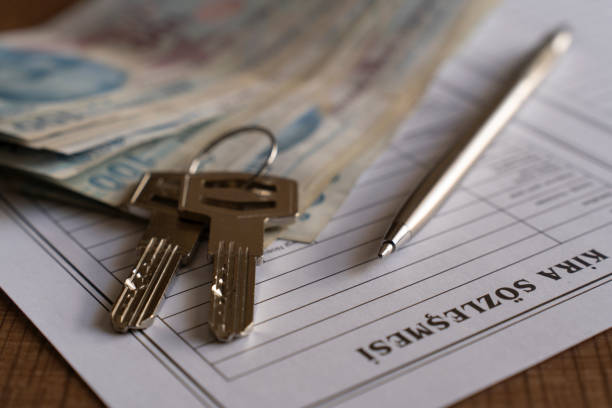 istock Turkish lease agreement form with pen and keys on it. 2020216339