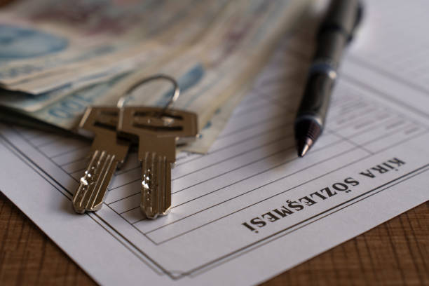 istock Turkish lease agreement form with pen and keys on it. 2020216342