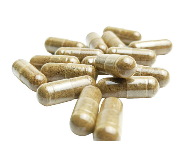 istock Herbal capsule medicine isolated on a white background 2020218517