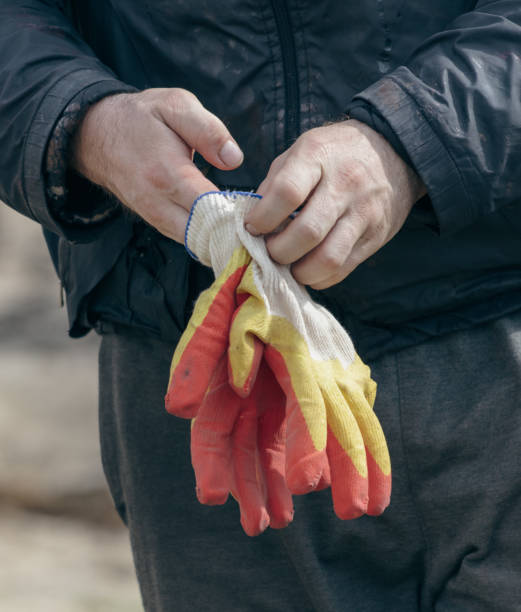 istock Close-up of male hands in protective construction gloves 2020233861