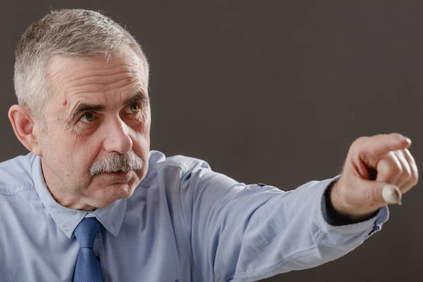 istock An elderly man expressively points his index finger in front of him. 2020235969