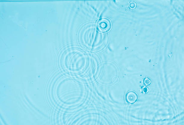 Abstract water cosmetic background with rings, water surface. Spa concept. Splash cosmetic moisturizer water micellar toner or emulsion