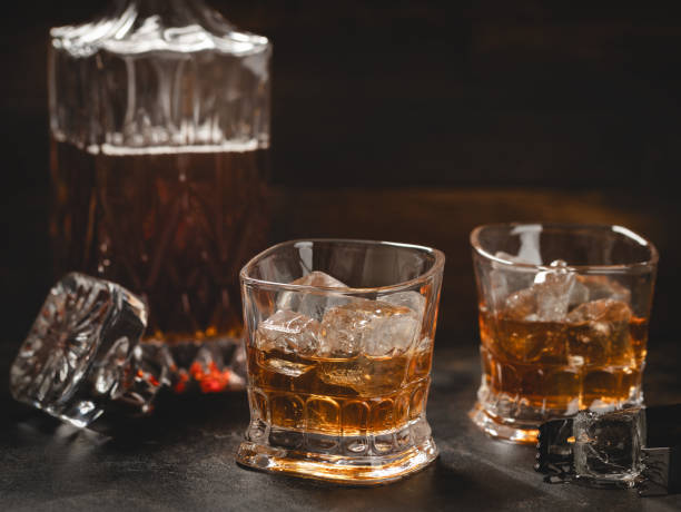 istock Glasses of whiskey with ice and decanter 2020287146