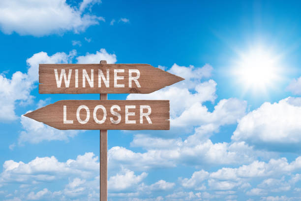 winner vs looser road sign. winner and looser concept. which way do you choose? - winner looser stock-fotos und bilder