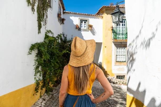 istock A woman visiting Obidos in Portugal. 2020420120