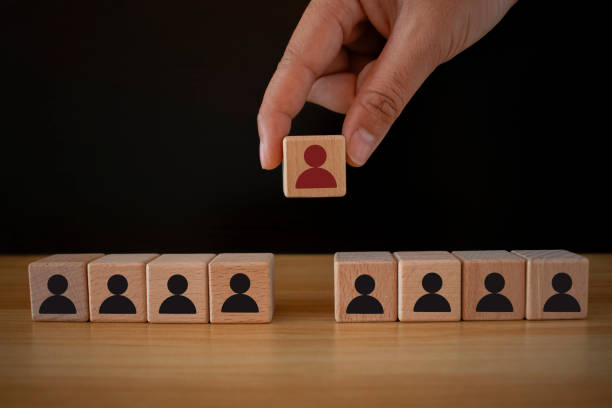 istock Hand holds wood cubes with person data, Customer psychology profile or characteristics.Human resource management and recruitment business concept,Human icon,Buyer personal and target customer concept. 2020439559