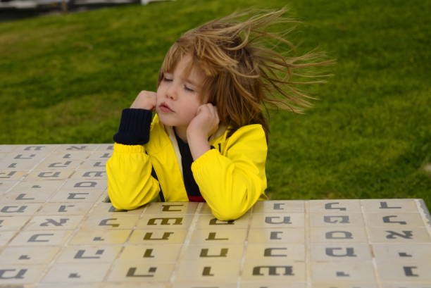 Primary school, learning the alphabet. The boy is learning Hebrew. School, tutor, kindergarten in Israel.