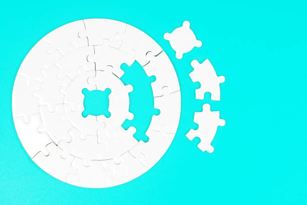 istock Blank Round Puzzle and Jigsaw Pieces on Blue 2020456404