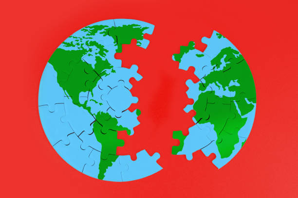 istock Divided Globe Puzzle: Green Continents, Blue Oceans on Red Background 2020457648