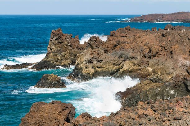 Los Hervideros rocks with splashing waves near El Golfo in Lanzarote, Spain.