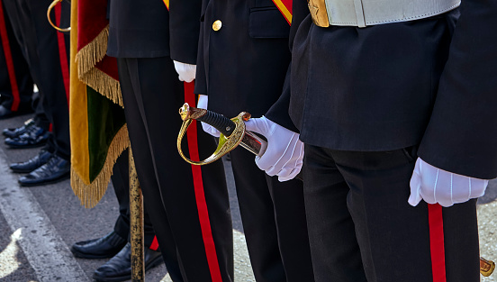Closeup of a small group of Royal Guards outside the Stockholm Palace performing a guard rotation, on a sunny day in Stockholm, Sweden