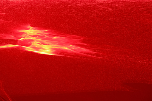 A beautiful photophone painted with a red laser as a result of light refraction.