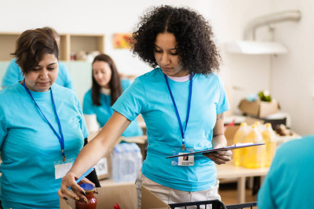 istock A female volunteer checking food donations 2020473816