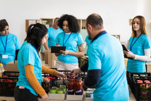 istock Volunteers working in a food bank 2020473822