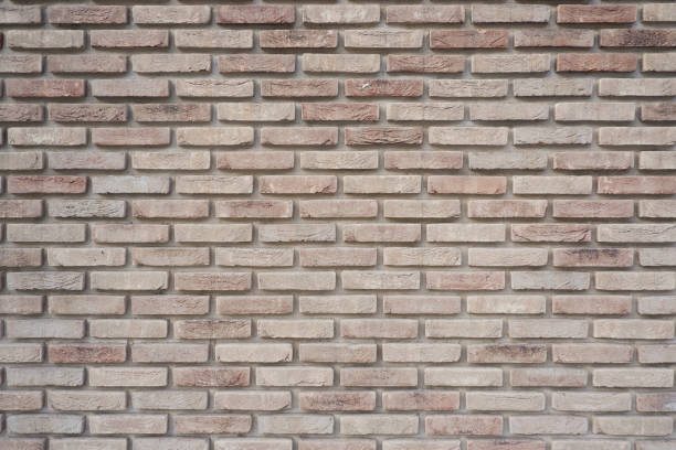 istock The wall is made of ceramic clinker bricks. Natural urban background. Space for creativity and text. Seamless background- abstract nature pattern. 2020474353