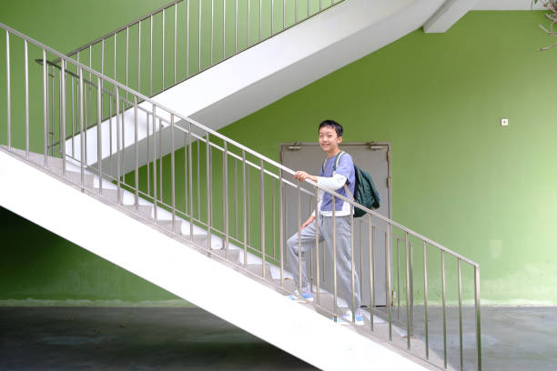 Little boy climbing up the stairs