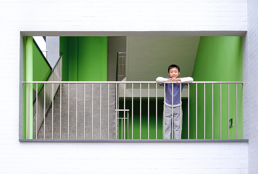 Little boy climbing up the stairs