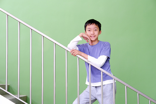 Little boy climbing up the stairs
