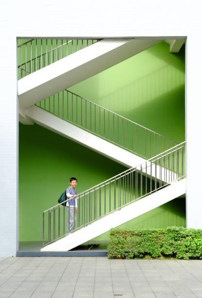 Little boy climbing up the stairs