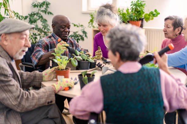 istock Nursing home residents completing a gardening activity together 2020503687