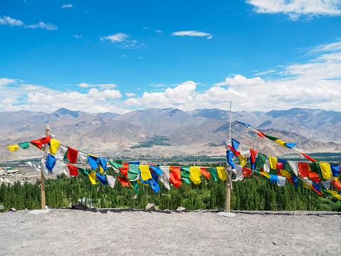 Colorful Buddhism Prayer flags at Stok village, Leh Ladakh, India with Himalayas mountain range background.