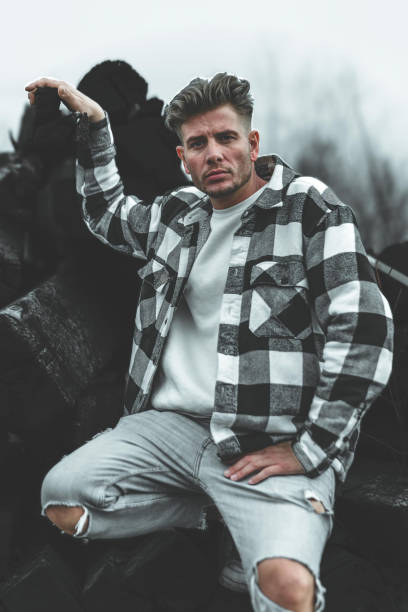 attractive young man in a denim shirt stock photo