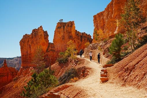 Park visitors enjoy the views and trail of Bryce Canyon National Park