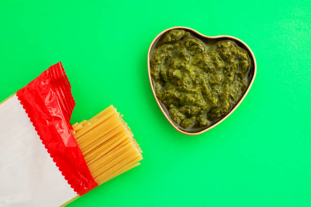 Package of spaghetti and Basil Pesto in a heart-shaped container