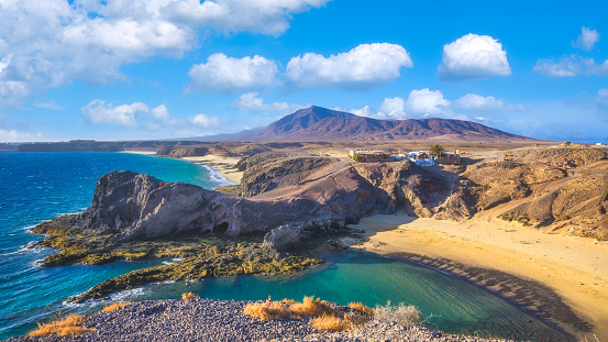 Landscape with turquoise ocean water on Papagayo beach, Lanzarote, Canary Islands, Spain. High quality photo