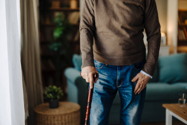 hands, walking stick or elderly person with disability, retirement closeup. senior care, cane or help with balance, support or parkinson disease with arthritis with health issue - human hand aging process senior adult cane ストックフォトと画像