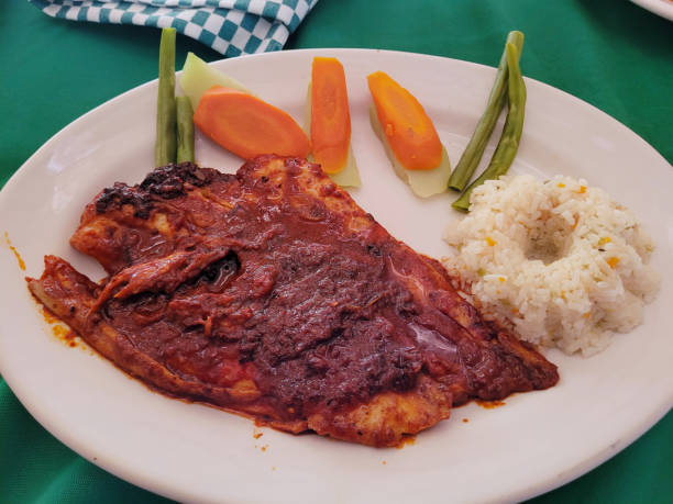 istock Spicy Fish dish called Filete a la Diabla with Rice and Steamed Vegetables 2020634163