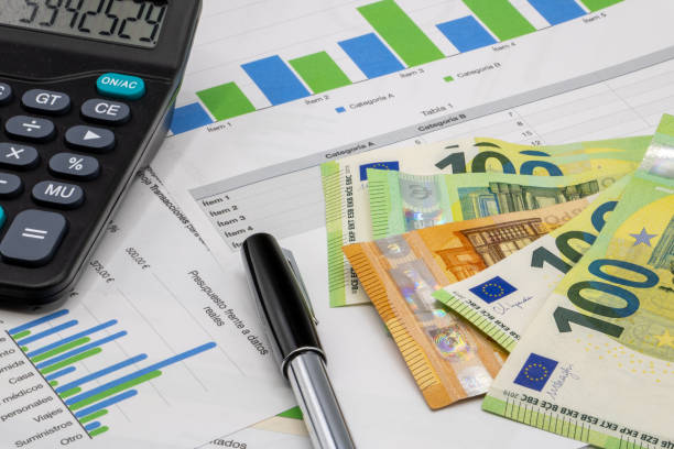 istock Calculator on finance graphs and euro bills 2020652946