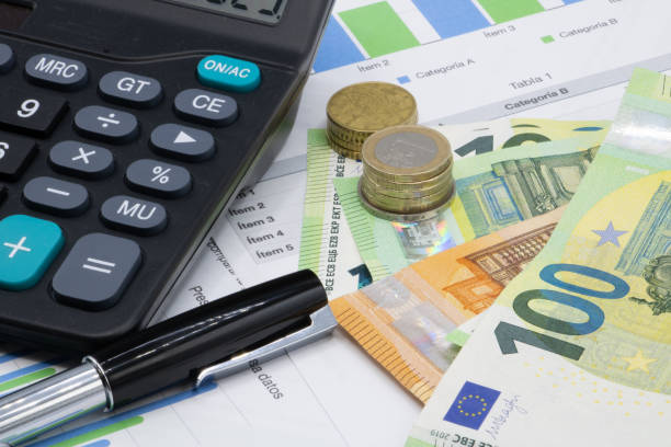istock Calculator on finance graphs and euro bills 2020653469