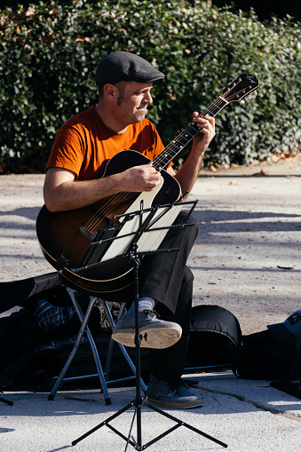 Madrid, Spain - January 28, 2024: Band of street musicians playing swing in Retiro Park