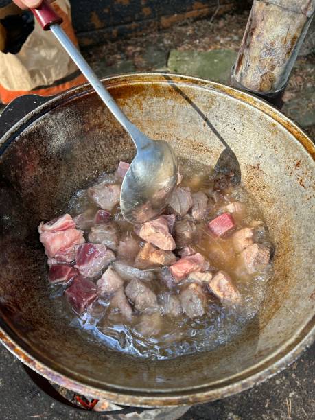 istock meat is fried in a cauldron in the open air 2020670378