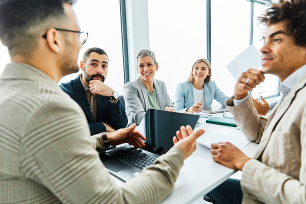 istock young business people meeting office teamwork group whiteboard presentation seminar talking portrait businessman table desk startup project idea portrait 2020673573