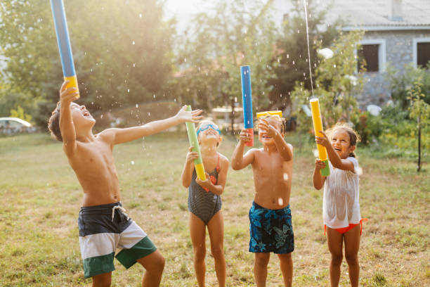istock Children having a water fight on a hot summer day 2020707781